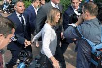 In a Aug. 27, 2019, file photo, Lori Loughlin departs federal court with her husband, clothing ...