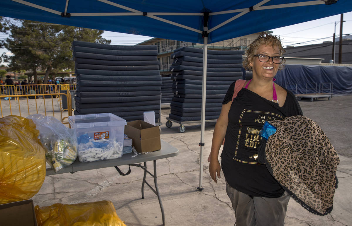 Client Denise Lankford speaks after washing as the Fresh Start Mobile Showers truck returns to ...