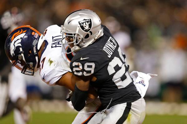 Denver Broncos tight end Noah Fant is stopped by Oakland Raiders free safety Lamarcus Joyner (2 ...