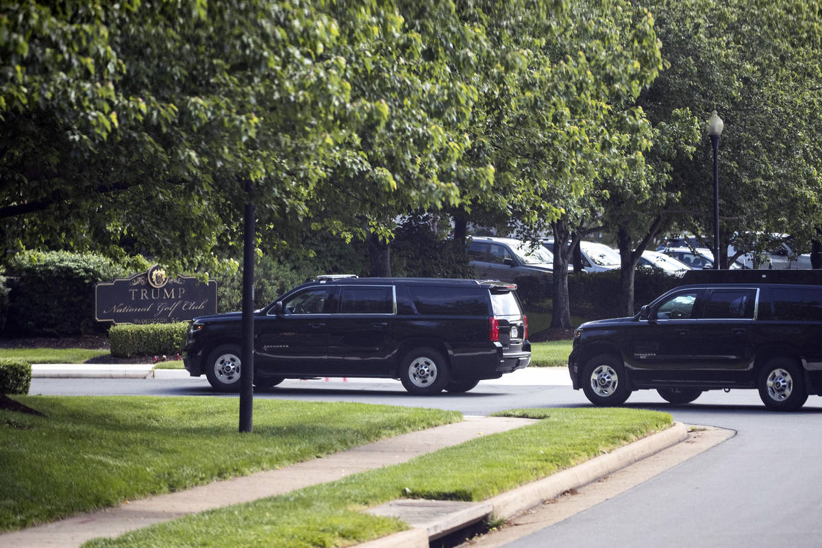 The motorcade for President Donald Trump arrives at Trump National Golf Club, Saturday, May 23, ...