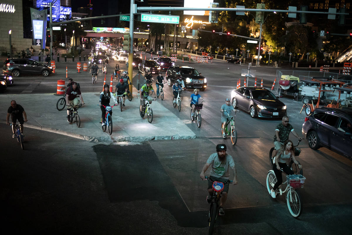 Bikers pedal down Las Vegas Boulevard on the Strip during Memorial Day weekend on Saturday, May ...