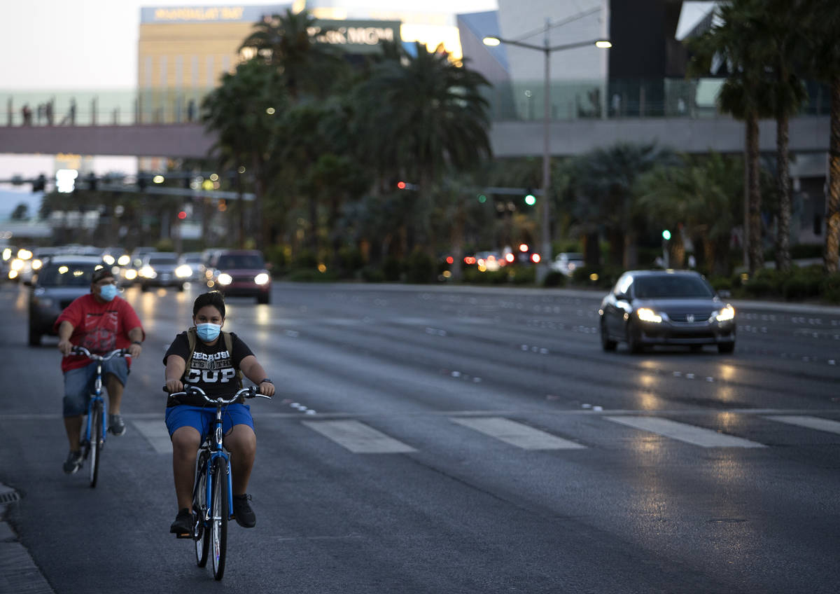 Bikers pedal down Las Vegas Boulevard on the Strip during Memorial Day weekend on Saturday, May ...