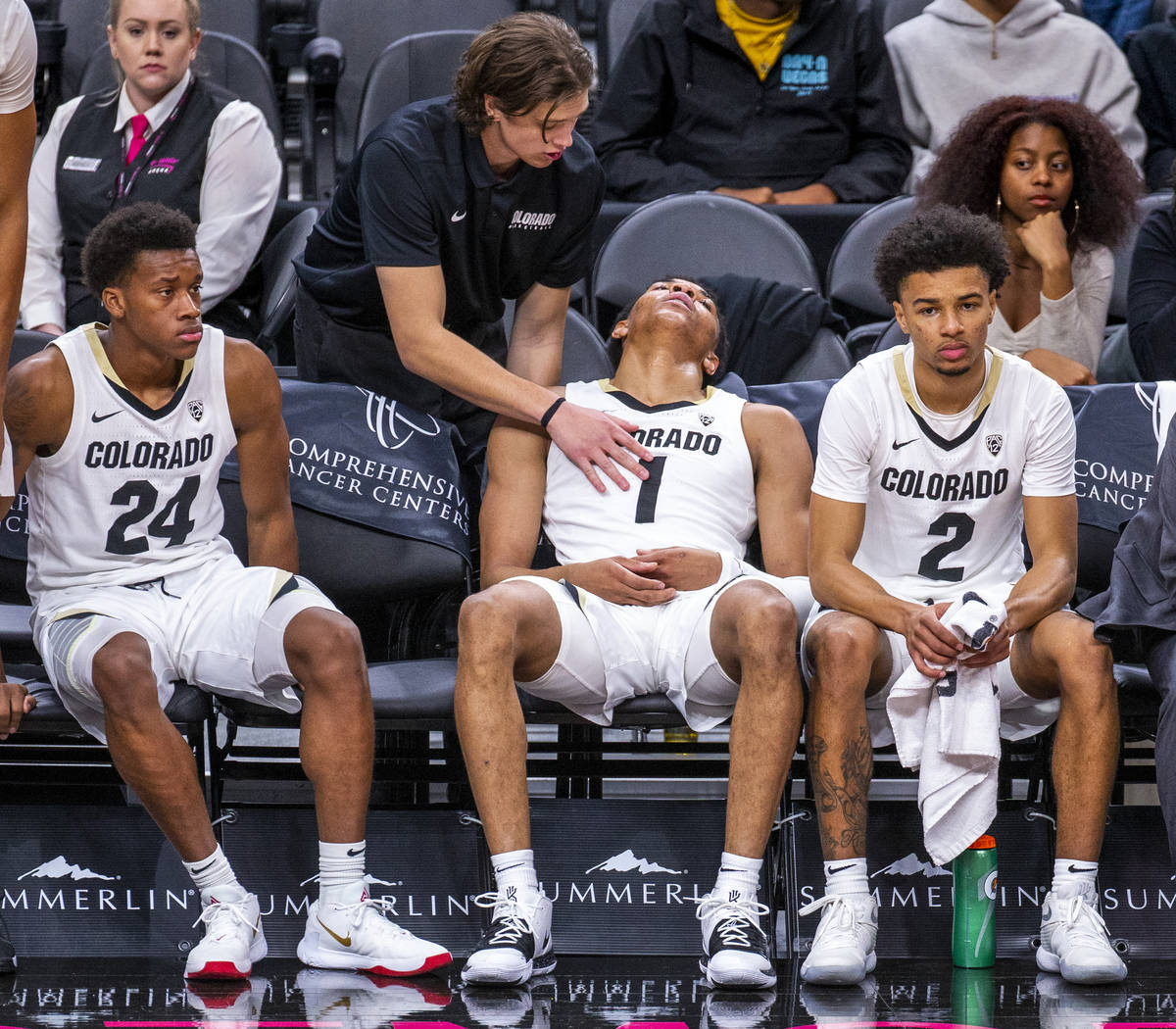 Colorado guard Tyler Bey (1, center) is tapped out on the bench during a rest versus Wyoming du ...