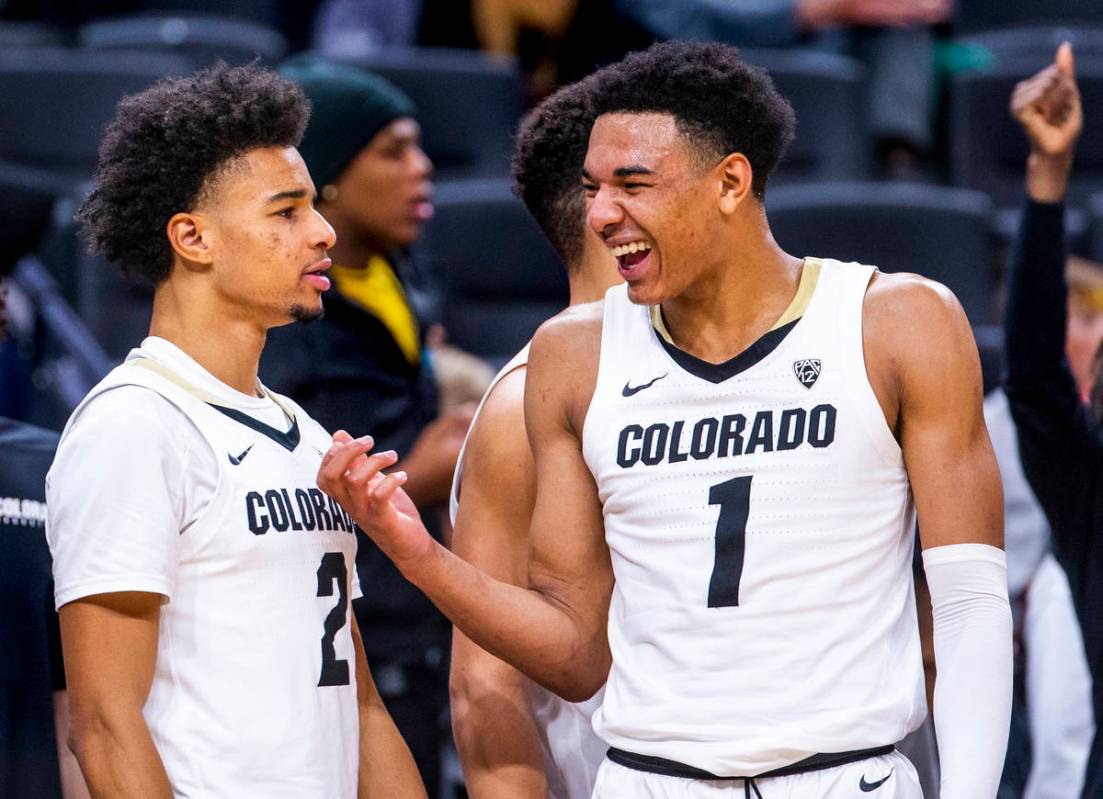 Colorado guard Tyler Bey (1, right) laughs with teammate Daylen Kountz (2) as the game winds do ...