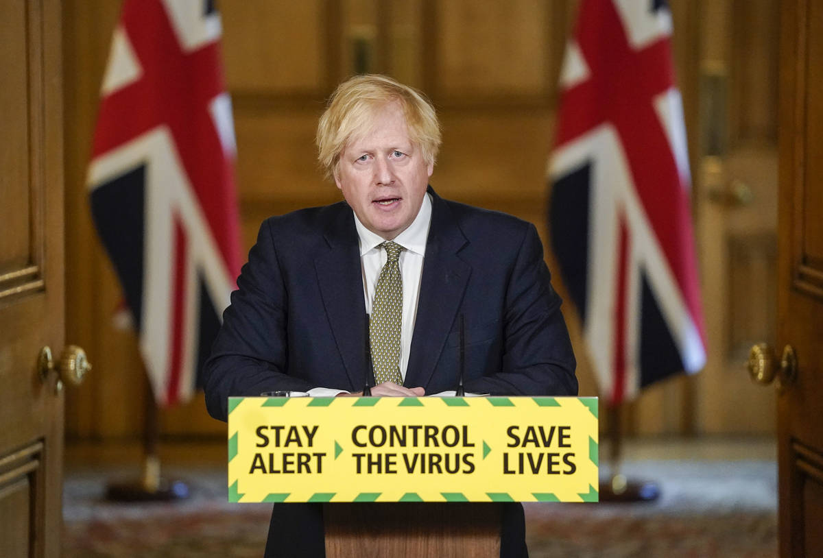 In this photo issued by 10 Downing Street, Britain's Prime Minister Boris Johnson speaks during ...