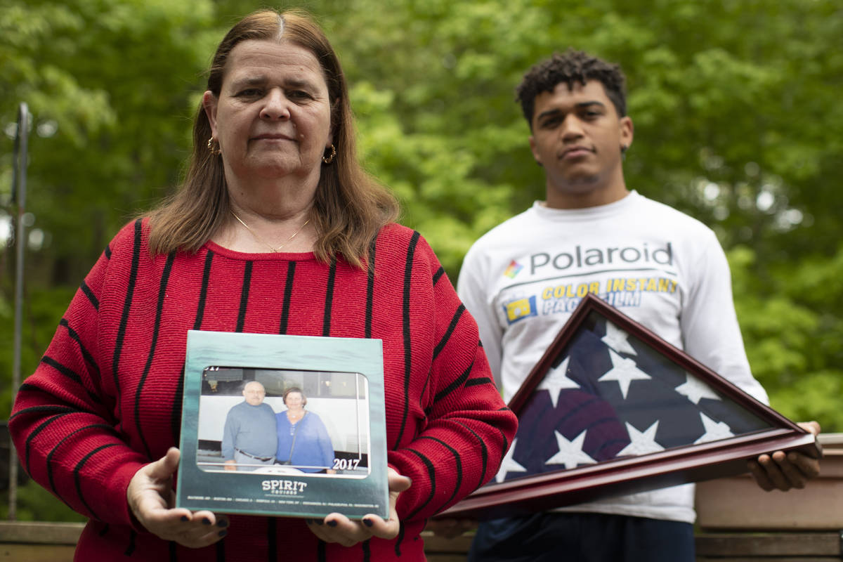 In this Friday, May 22, 2020, photo Florence Hopp, left, holds a photograph of herself and her ...
