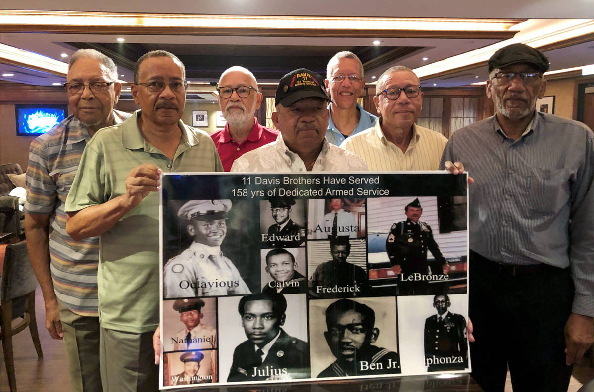 FILE - In this July 12, 2019 file photo, from the left; Eddie Davis and his brothers Julius, Oc ...