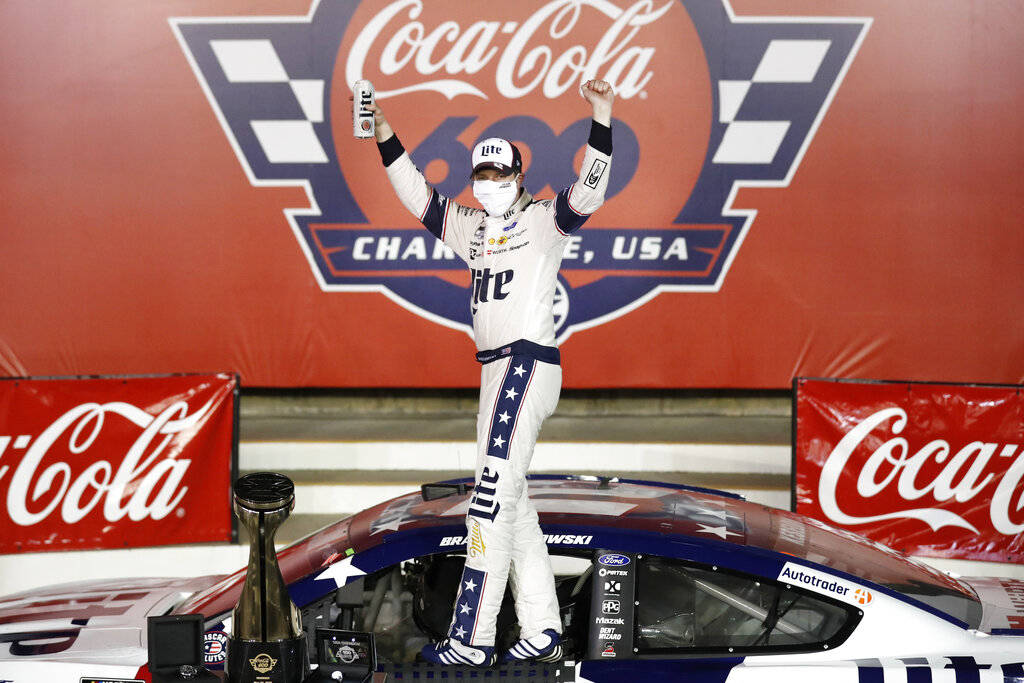 Brad Keselowski celebrates after winning the NASCAR Cup Series auto race at Charlotte Motor Spe ...