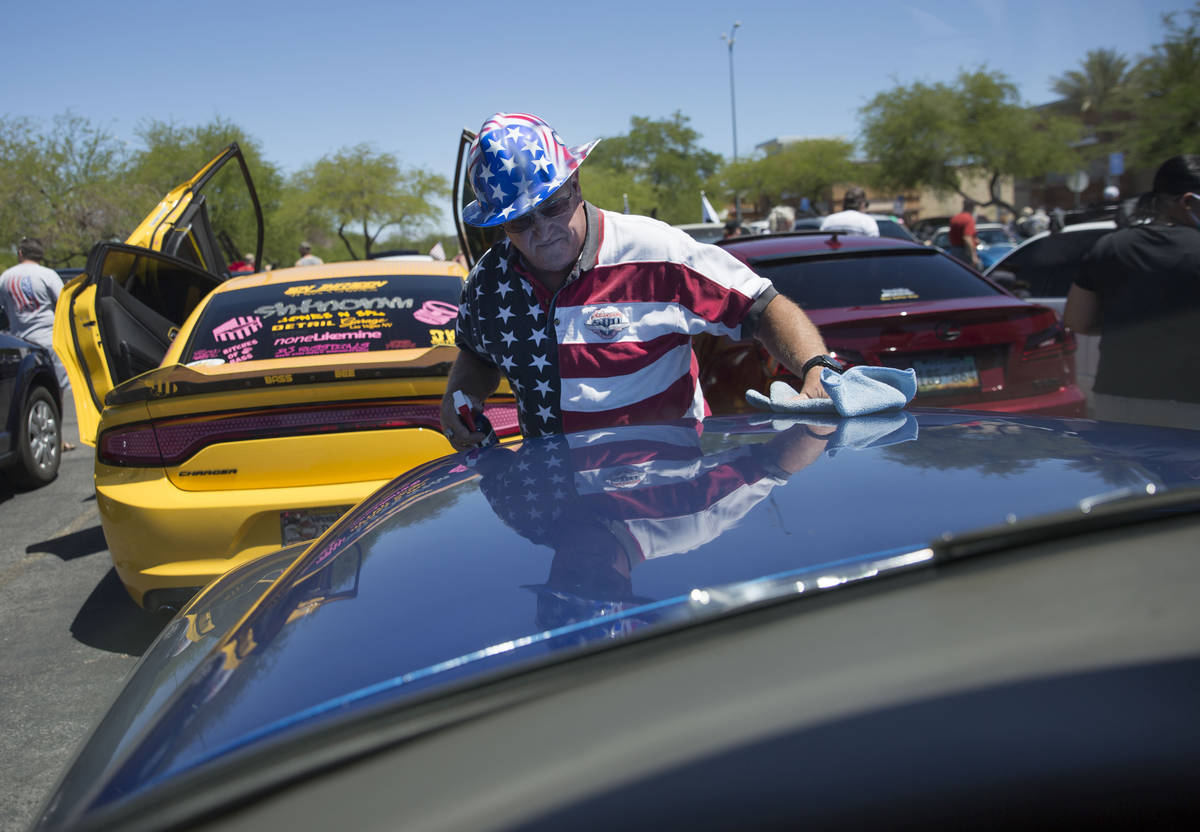 Brad Kreutzer cleans a 1954 Ford Panel as he waits to participate in the first “Hot Rods for ...