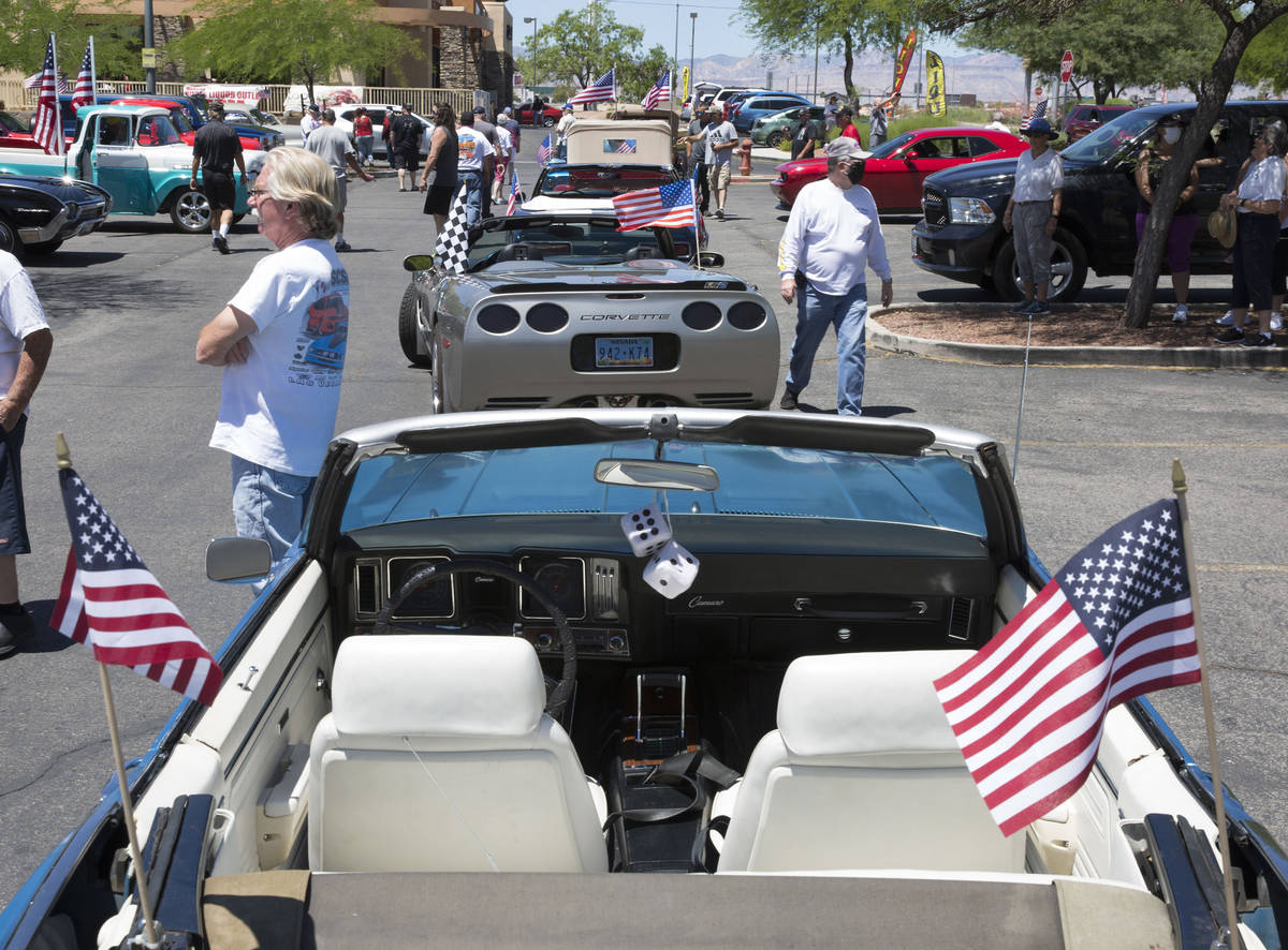 Classic cars and other vehicles participate in the first “Hot Rods for Heroes” by cruising ...
