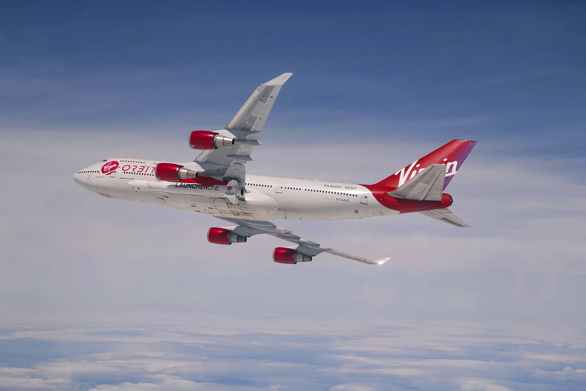 This Sunday, April 12, 2020 photo provided by Virgin Orbit shows a Boeing 747 with a rocket slu ...