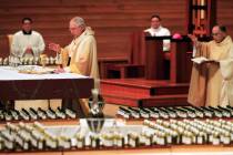 FILE - In this April 6, 2020 file photo, Los Angeles Archbishop Jose H. Gomez, front, celebrate ...