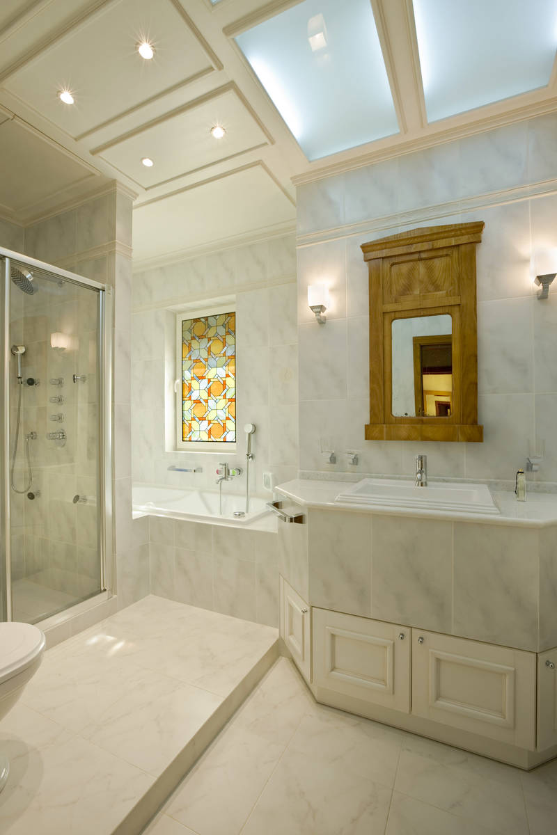 The stained-glass window over the tub provides privacy and makes a stunning statement. (Getty I ...