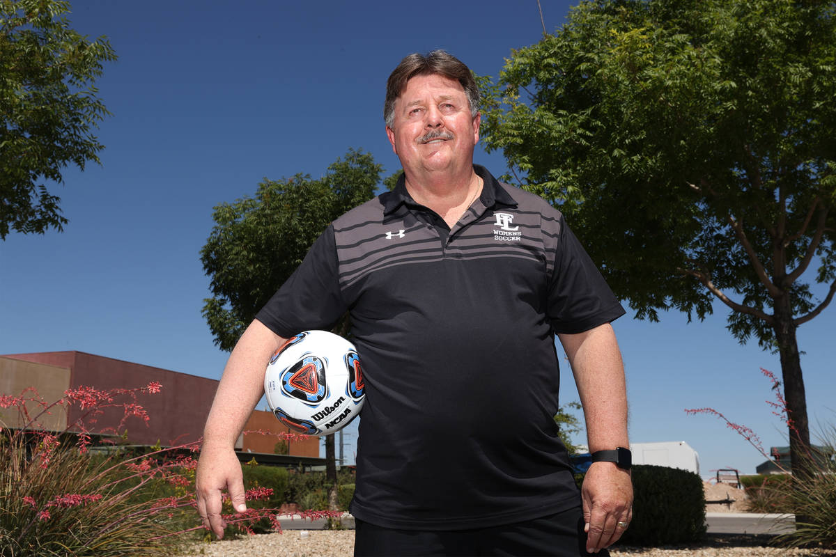 Bob Chinn, head coach of the Faith Lutheran girl's varsity team, poses for a photo at Faith Lut ...