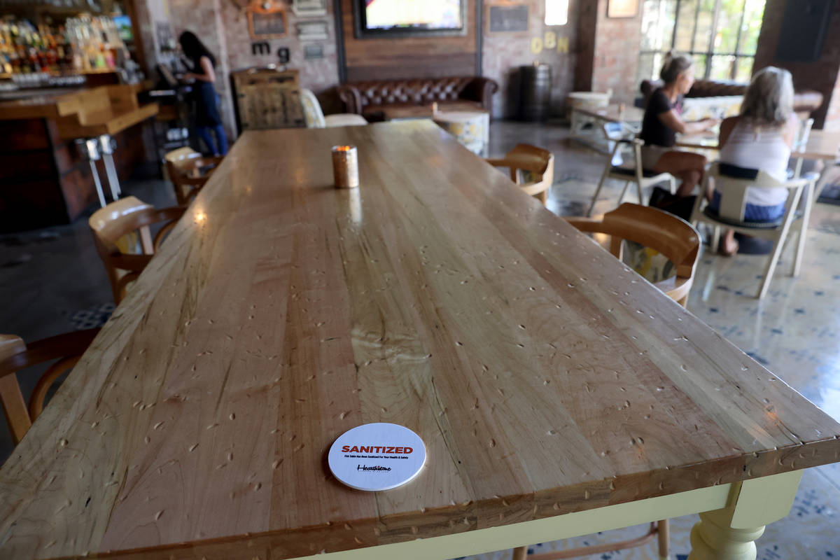 A table is marked as sanitized Hearthstone Kitchen & Cellar at Red Rock Resort in Las Vegas Tue ...