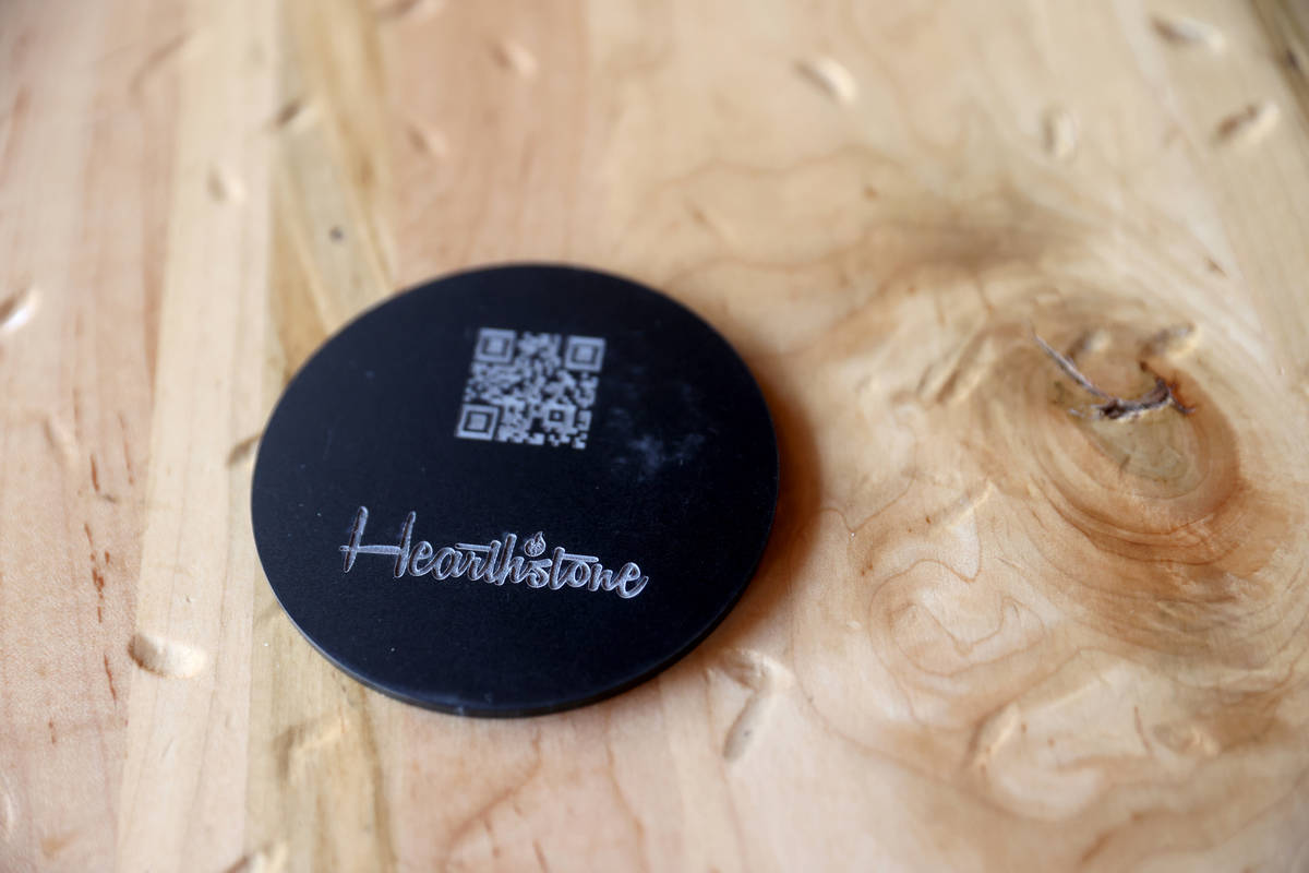 A coaster with a QR Code for the menu at Hearthstone Kitchen & Cellar at Red Rock Resort in Las ...