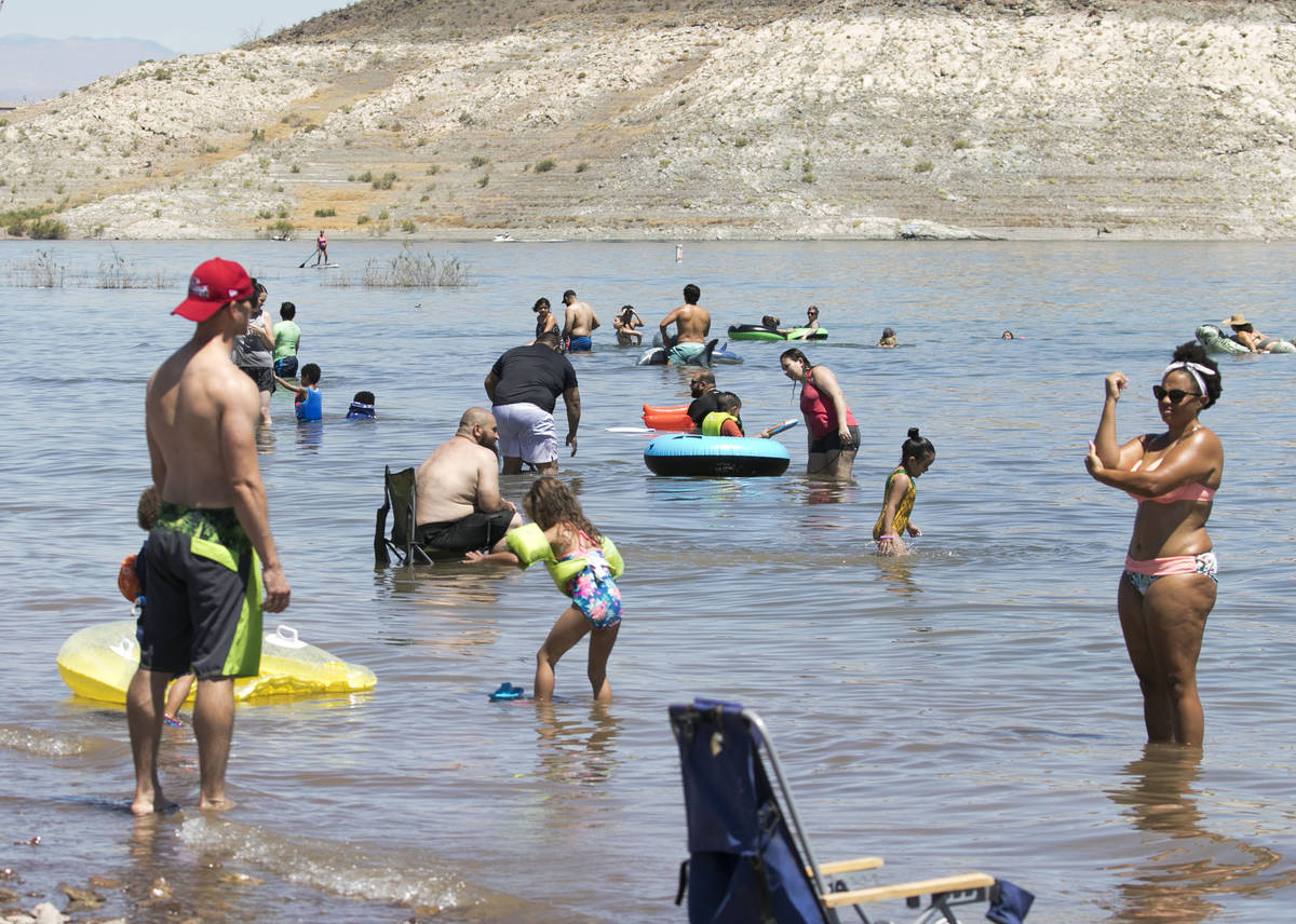 People cool themselves at Boulder beach in the Lake Mead National Recreation Area on Wednesday, ...
