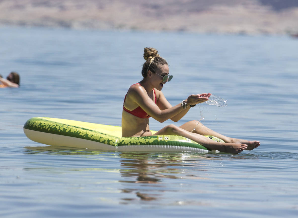 Chantell Legacy of Henderson cools herself at Boulder beach in the Lake Mead National Recreatio ...