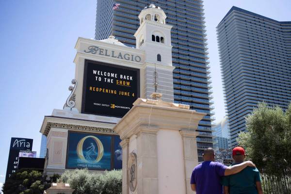 The Bellagio marquee says the hotel and casino, owned big MGM Resorts International, will open ...