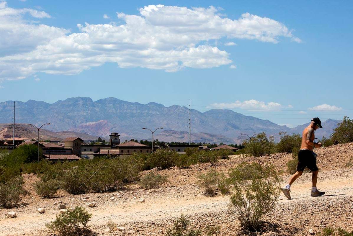 A man runs up the hill at Exploration Peak Park on Wednesday, May 27, 2020, in Las Vegas. The N ...
