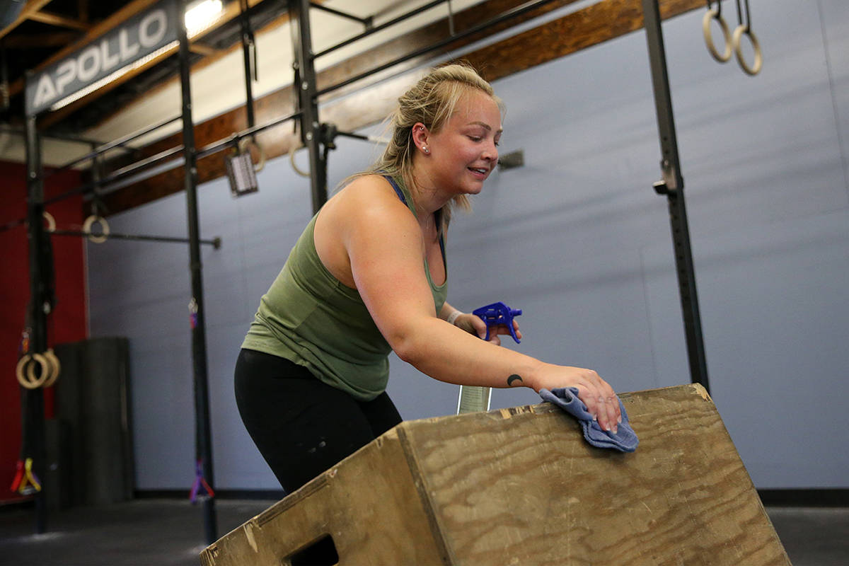 Kelci Swartz cleans her equipment after working out at Crossfit Apollo in Las Vegas, Friday, Ma ...