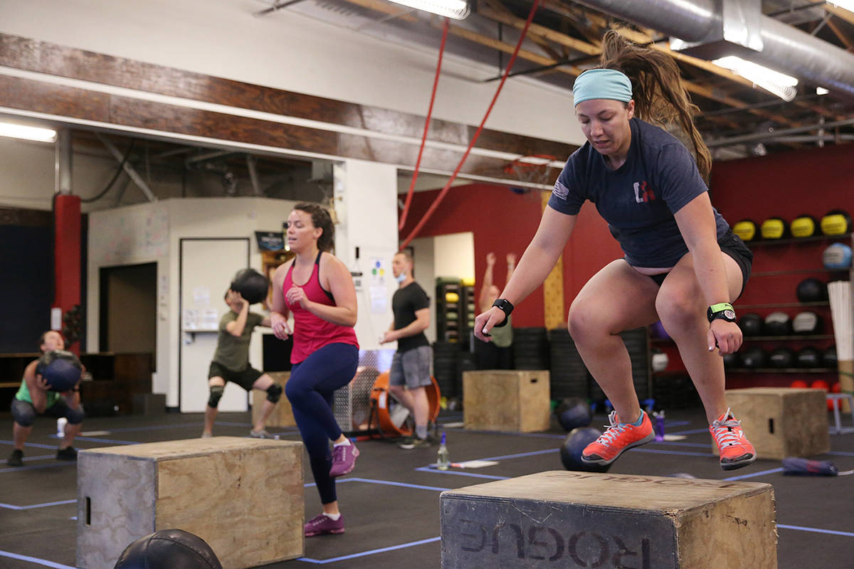 Nicole Perhala, left, and Skye Mooibroek workout during a class at Crossfit Apollo in Las Vegas ...