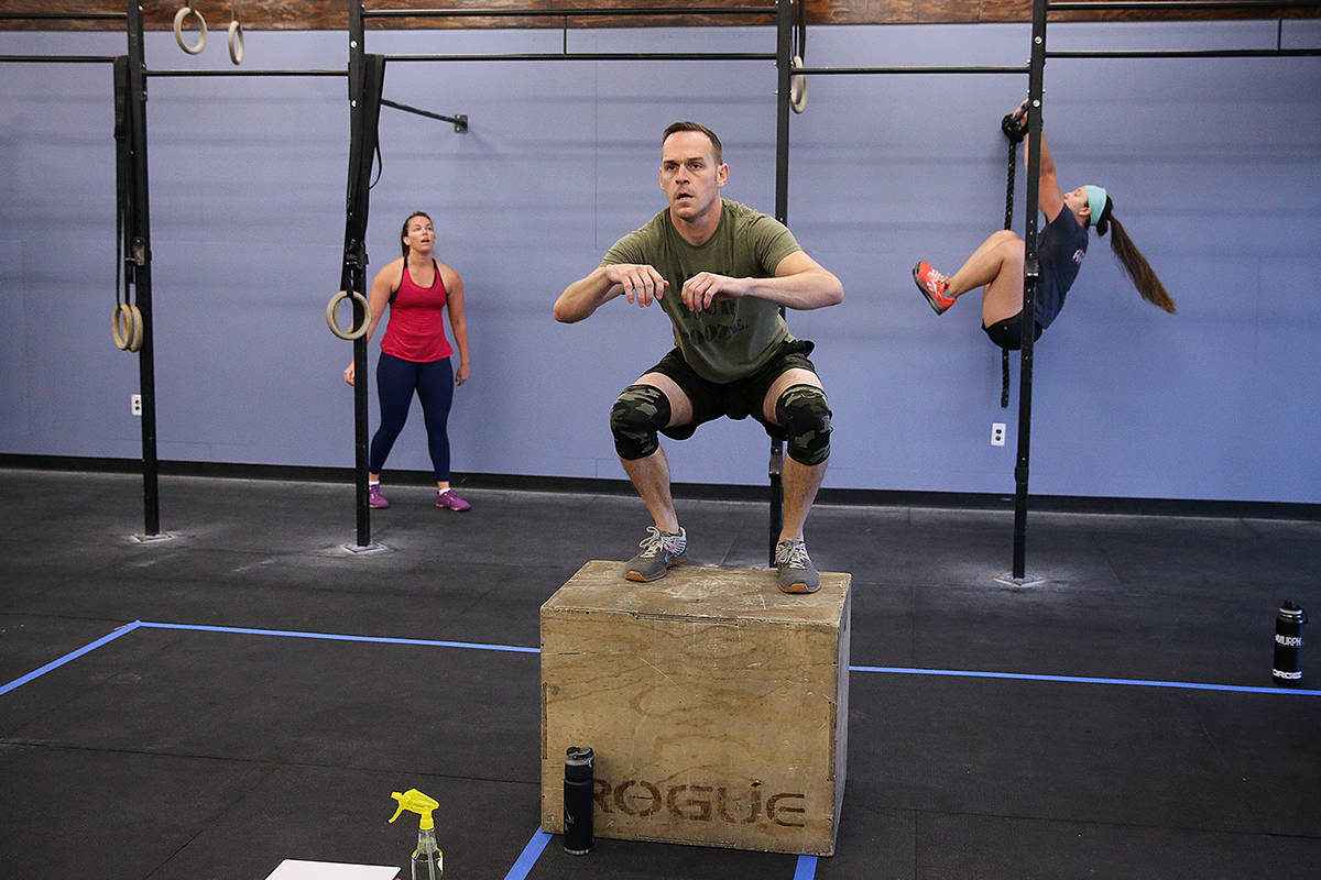 Sam Dukes, center, works out during a class at Crossfit Apollo in Las Vegas, Friday, May 29, 20 ...
