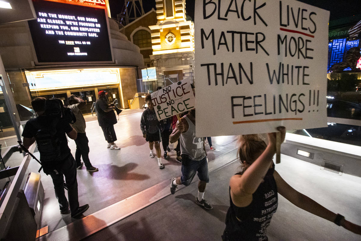 Demonstrators march to demand justice for George Floyd along the Las Vegas Strip on Thursday, M ...