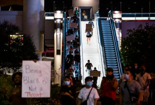 Demonstrators march to demand justice for George Floyd along the Las Vegas Strip on Thursday, M ...