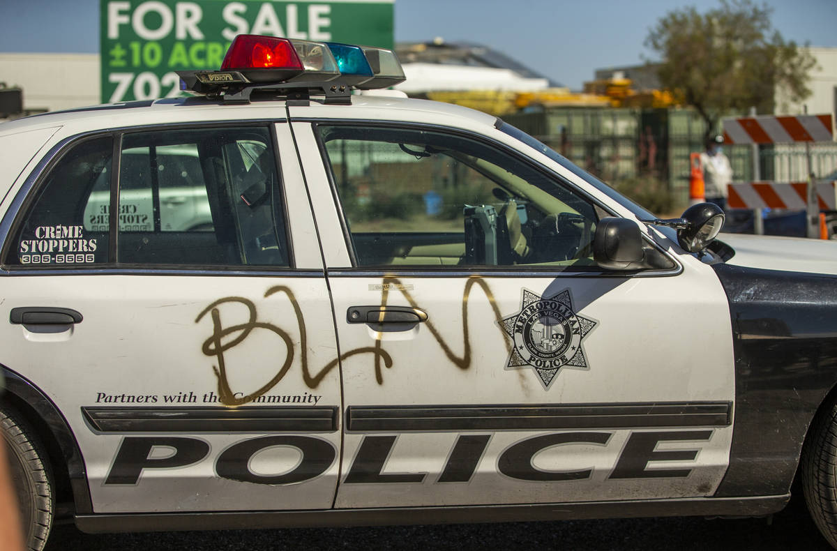 A Las Vegas Police car is sprayed with the letters BLM near Circus Circus during a Black Lives ...