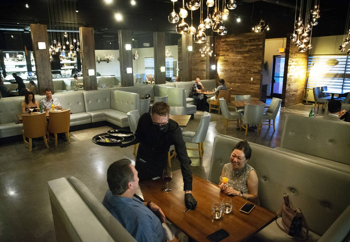 David and Lisa French, bottom, enjoy dinner at Partage on Wednesday, May 27, 2020, in Las Vegas ...