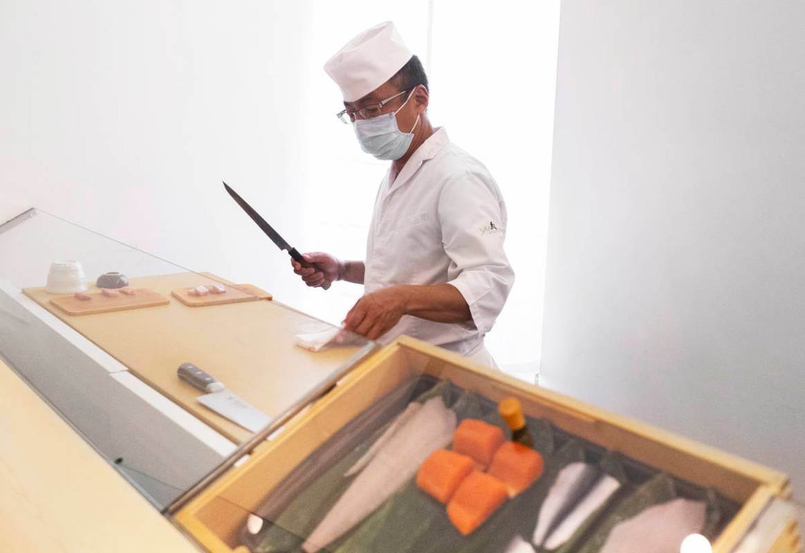 Executive chef Kaz Iida prepares sushi at Yui Edomae Sushi on Thursday, May 28, 2020, in Las Ve ...