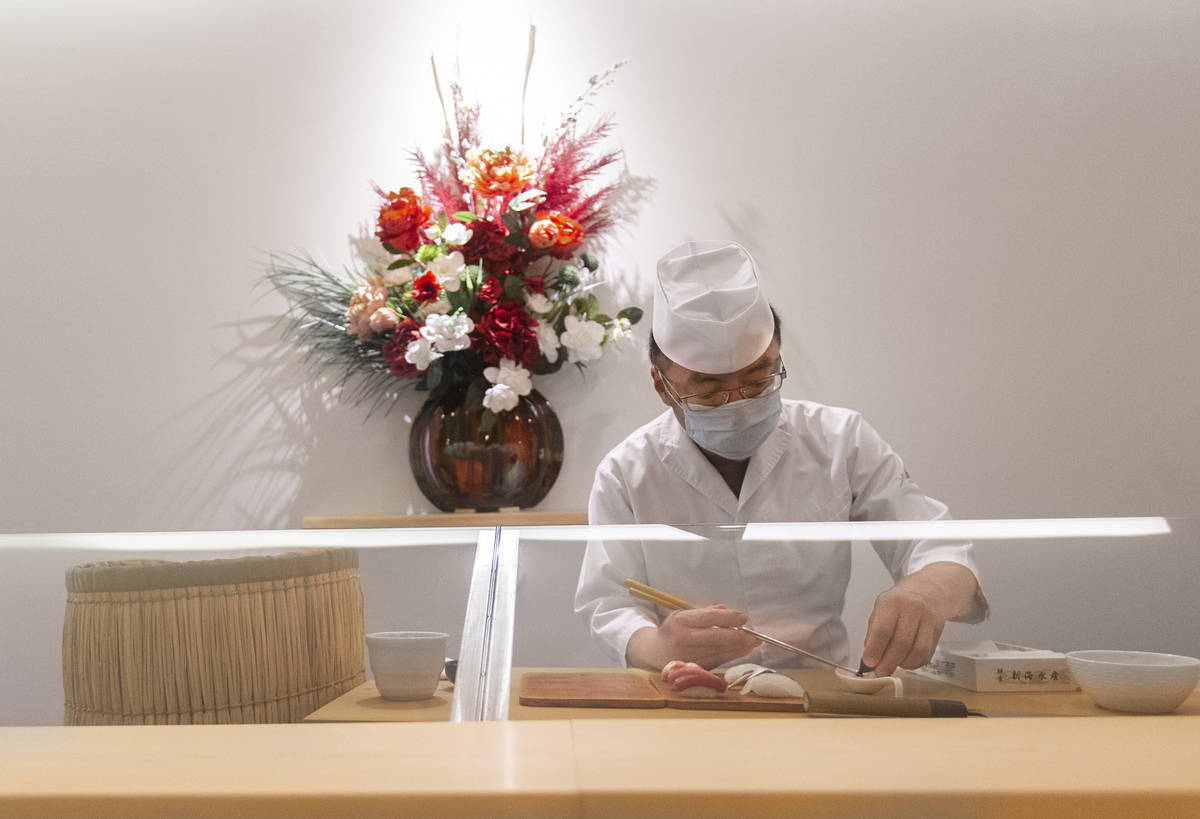 Executive chef Kaz Iida prepares sushi at Yui Edomae Sushi on Thursday, May 28, 2020, in Las Ve ...