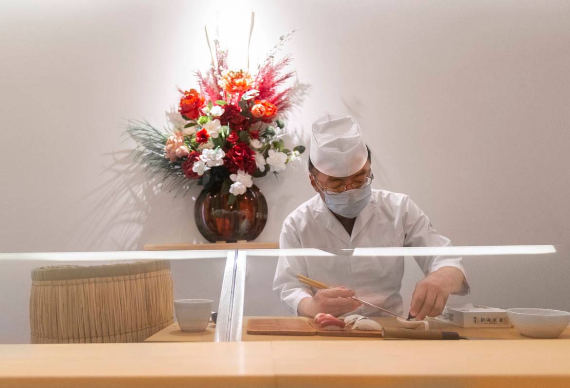 Executive chef Kaz Iida prepares sushi at Yui Edomae Sushi on Thursday, May 28, 2020, in Las Ve ...