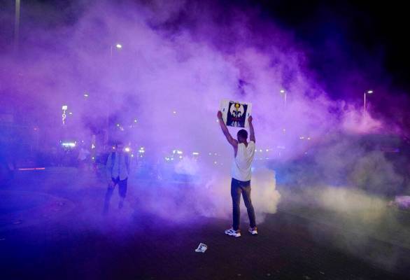 Protesters clash with Dallas police officers at Griffin and Young, Friday, May 29, 2020, in Dal ...