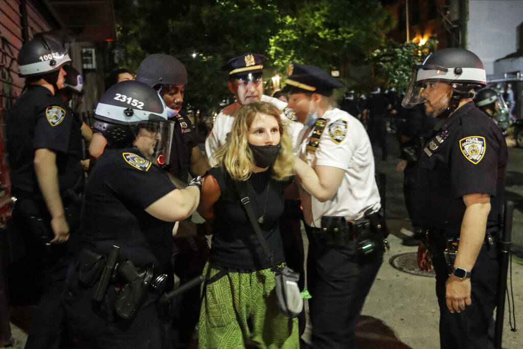Police officers arrest protestors near Barclays Center after a rally over the death of George F ...