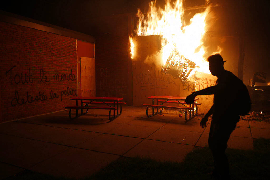 People set a fire during continued protest Friday, May 29, 2020, in Minneapolis. Protests conti ...