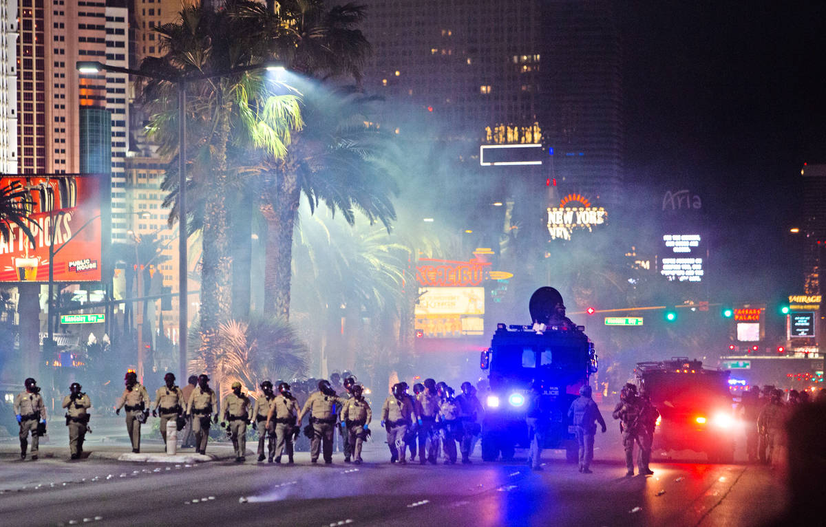 Las Vegas police fire tear gas at Black Lives Matter protesters on Sunday, May, 31, 2020, on th ...