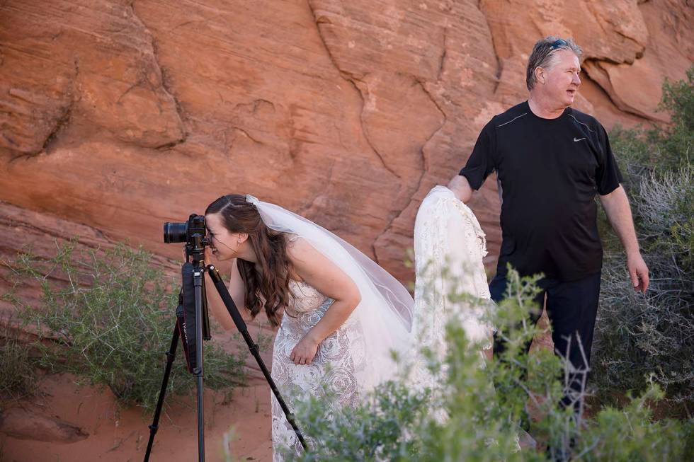 Ashley Johns sets up her camera to record the ceremony, which was moved to Valley of Fire State ...