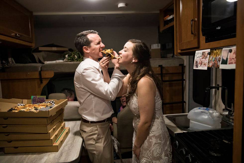 The newlyweds share a pizza toast in the RV in which her mother and stepfather had spent the pr ...