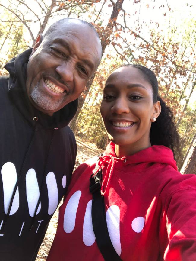 Roscoe and A'ja Wilson take a selfie together in matching sweatshirts.