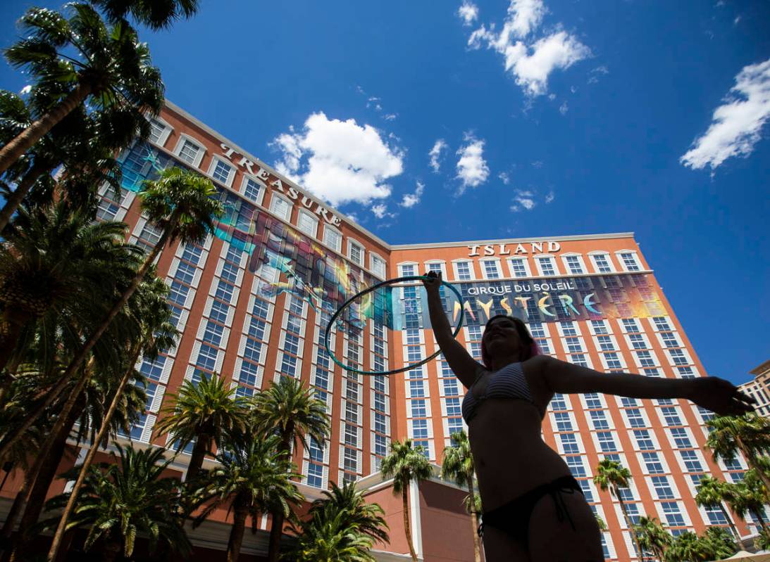 Hana Strauss, from Salt Lake City, Utah, hula hoops by the pool at TI on Thursday, June 4, 2020 ...