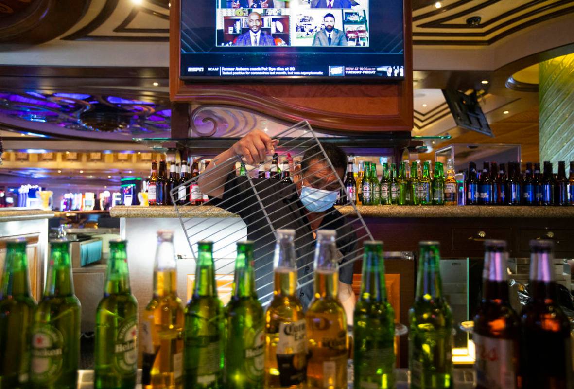 Bartender Antonio Argueea prepares his station to reopen at TI on Monday, June 1, 2020, in Las ...