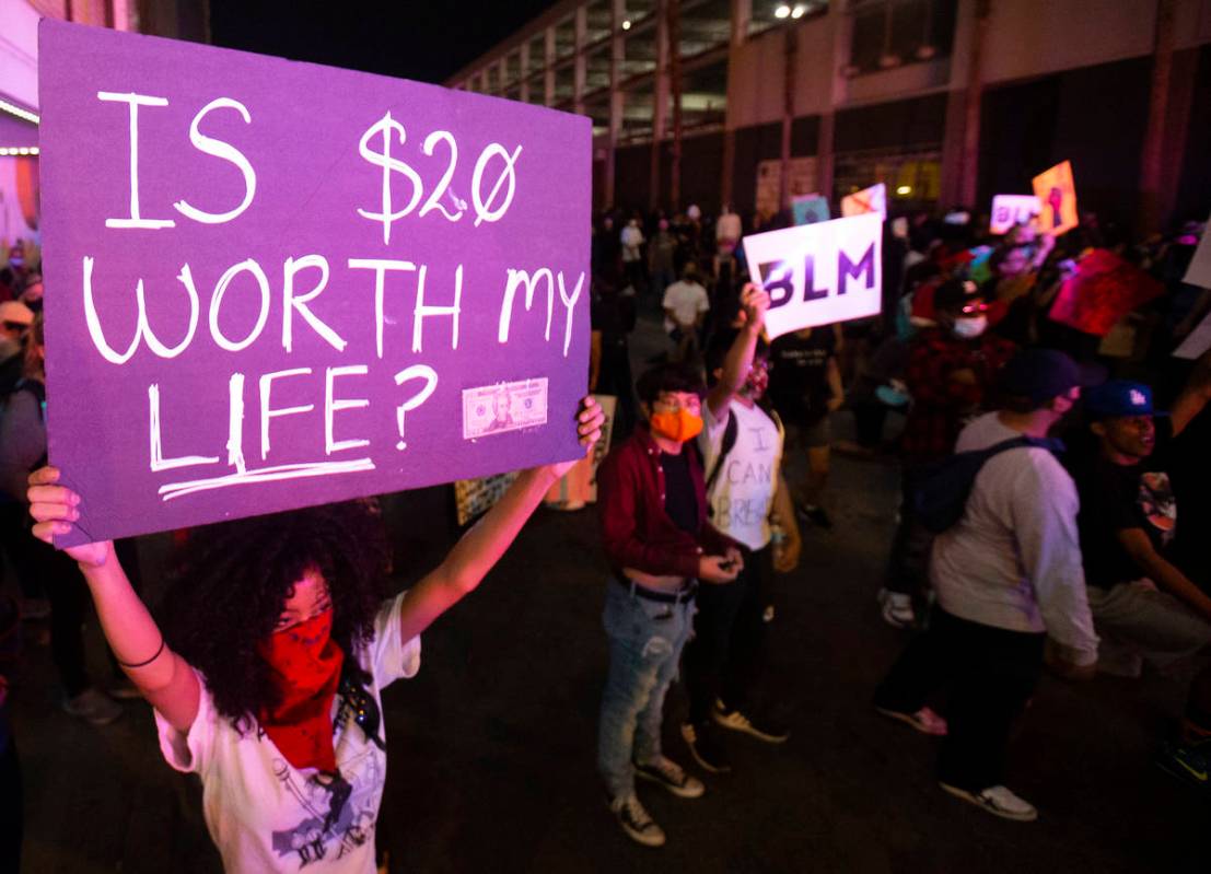 A large crowd organized by Black Lives Matter protests in downtown Las Vegas on Monday, June 1, ...