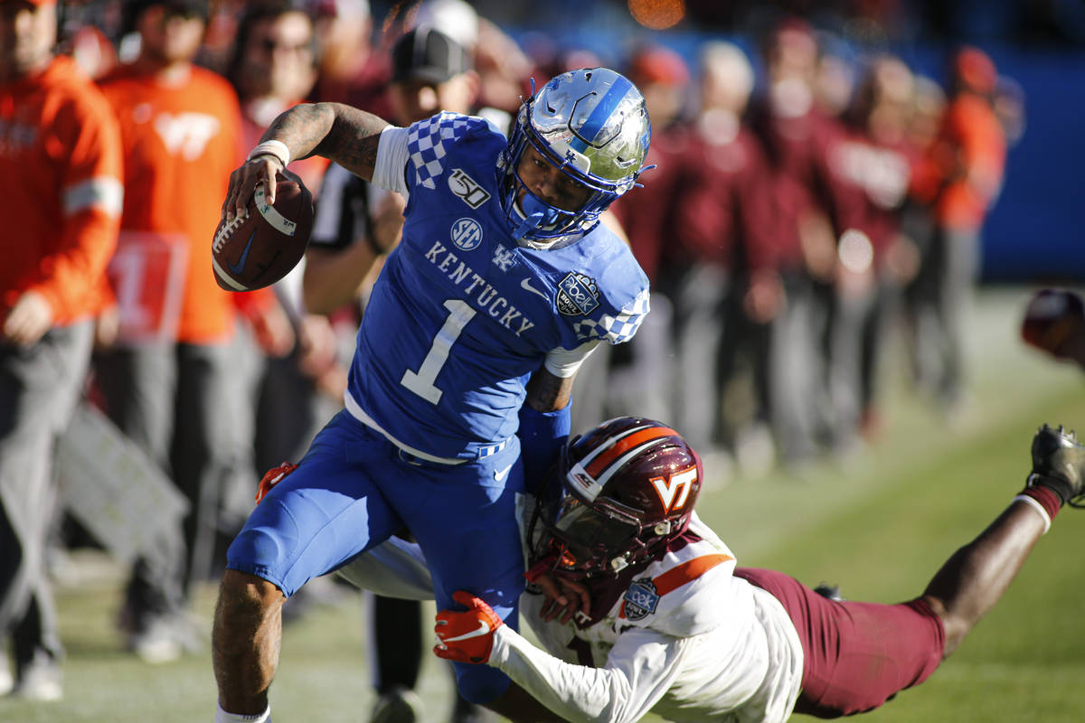 Kentucky quarterback Lynn Bowden Jr. (1) carries the football against Virginia Tech defensive b ...