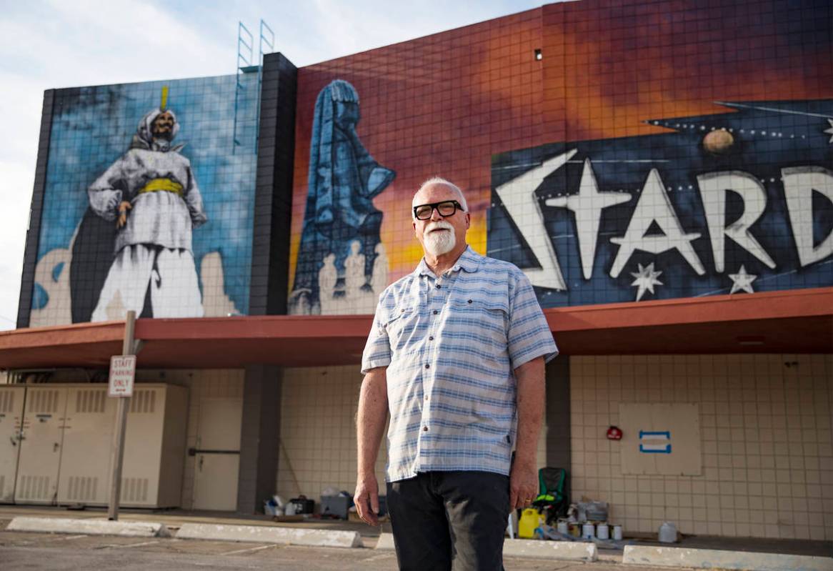 Artist James Stanford stands in front of his mural, “From the Land Beyond Beyond,&#x201d ...