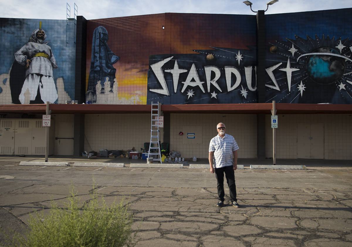 Artist James Stanford stands in front of his mural, “From the Land Beyond Beyond,&#x201d ...