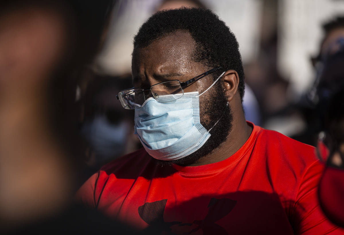 A crowd of at least 300 people protest outside Las Vegas City Hall on Wednesday, June 3, 2020, ...