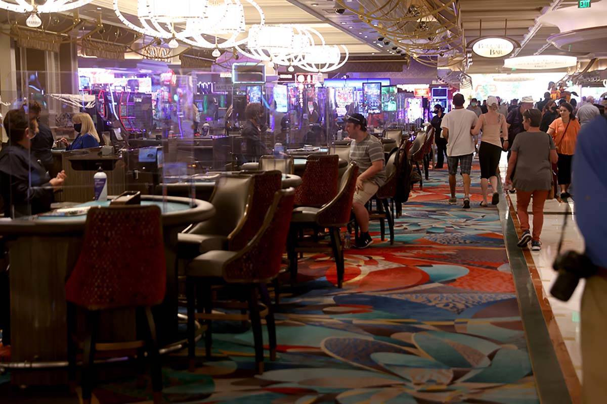 Guests play blackjack at the Bellagio on the Las Vegas Strip as the resort reopens after 78 day ...