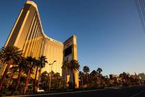 The sunrise reflects off Mandalay Bay on the Las Vegas Strip as casinos prepare to reopen on Th ...